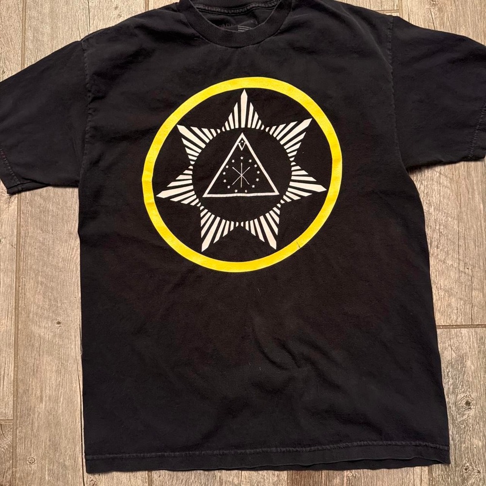 Black Scale t-shirt with white and yellow geometric star and triangle design